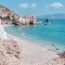 A Rocky Beach With a Body of Water in the Background
